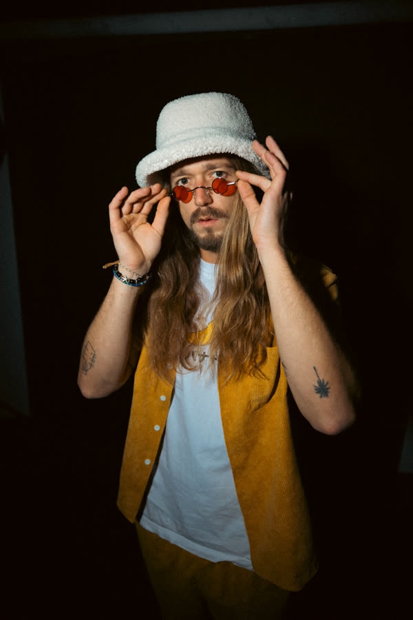 Jake adjusting his sunglasses