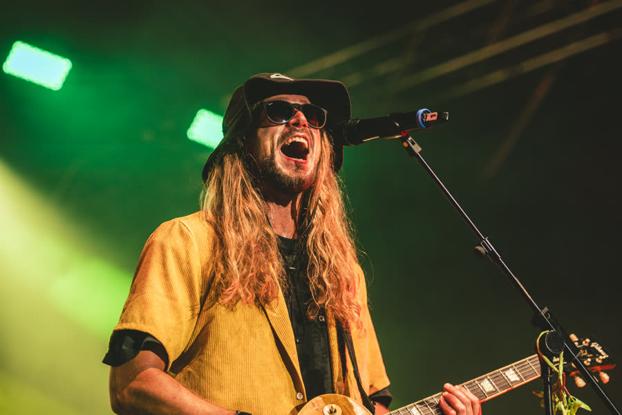 Jake singing with electric guitar