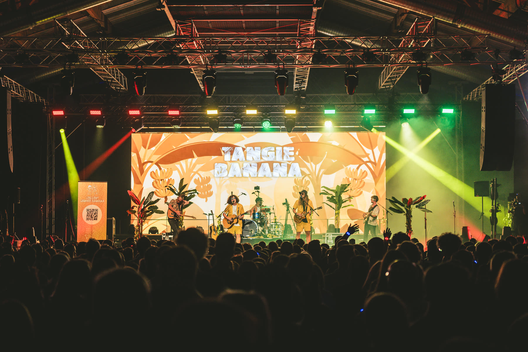 The whole band on stage in front of the crowd
